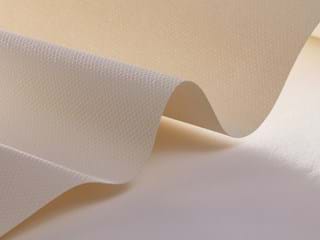 Close-up of a soft, beige fabric with a subtle wavy pattern, highlighting its texture and gentle folds. The fabric appears smooth and has a delicate sheen, catching light softly.