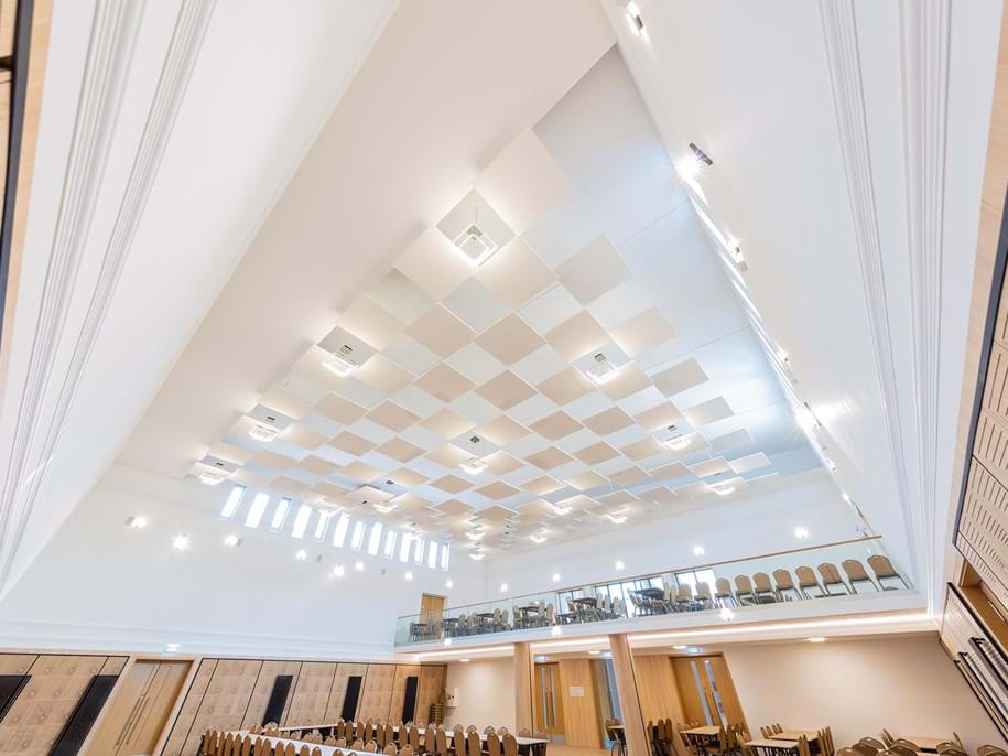Free-hanging acoustic ceiling panels in culture house