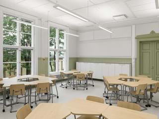 Valkoiset akustiset seinälevyt luokassa, jossa on pöytäryhmät ja tuolit