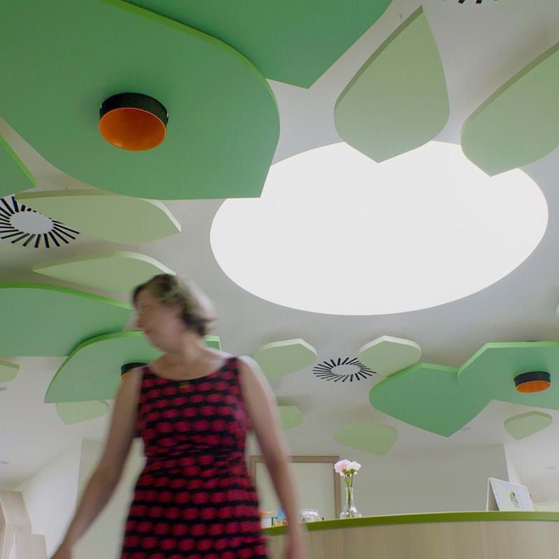 Acoustic free-hanging ceiling panels in the shape of leaves in kindergarten