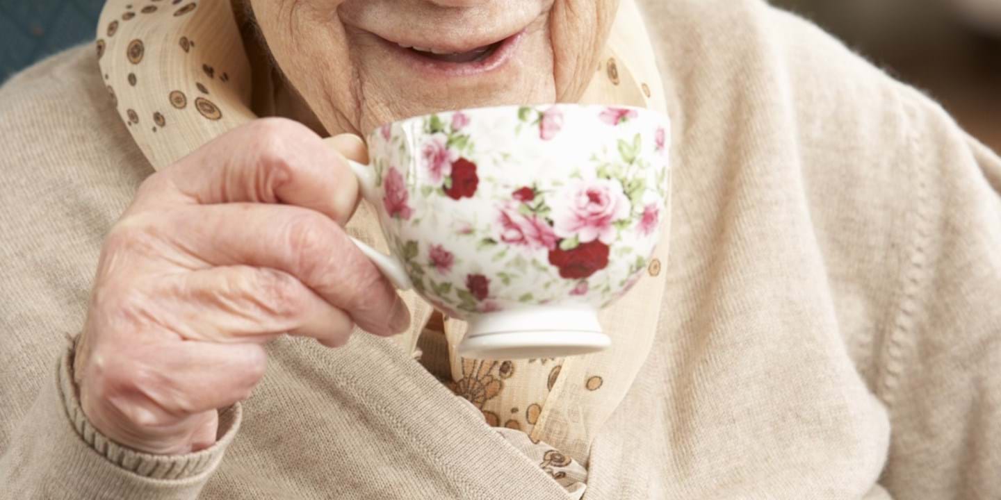 Elderly lady drinking