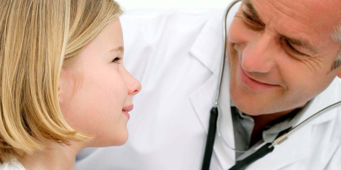 Doctor examining young patient