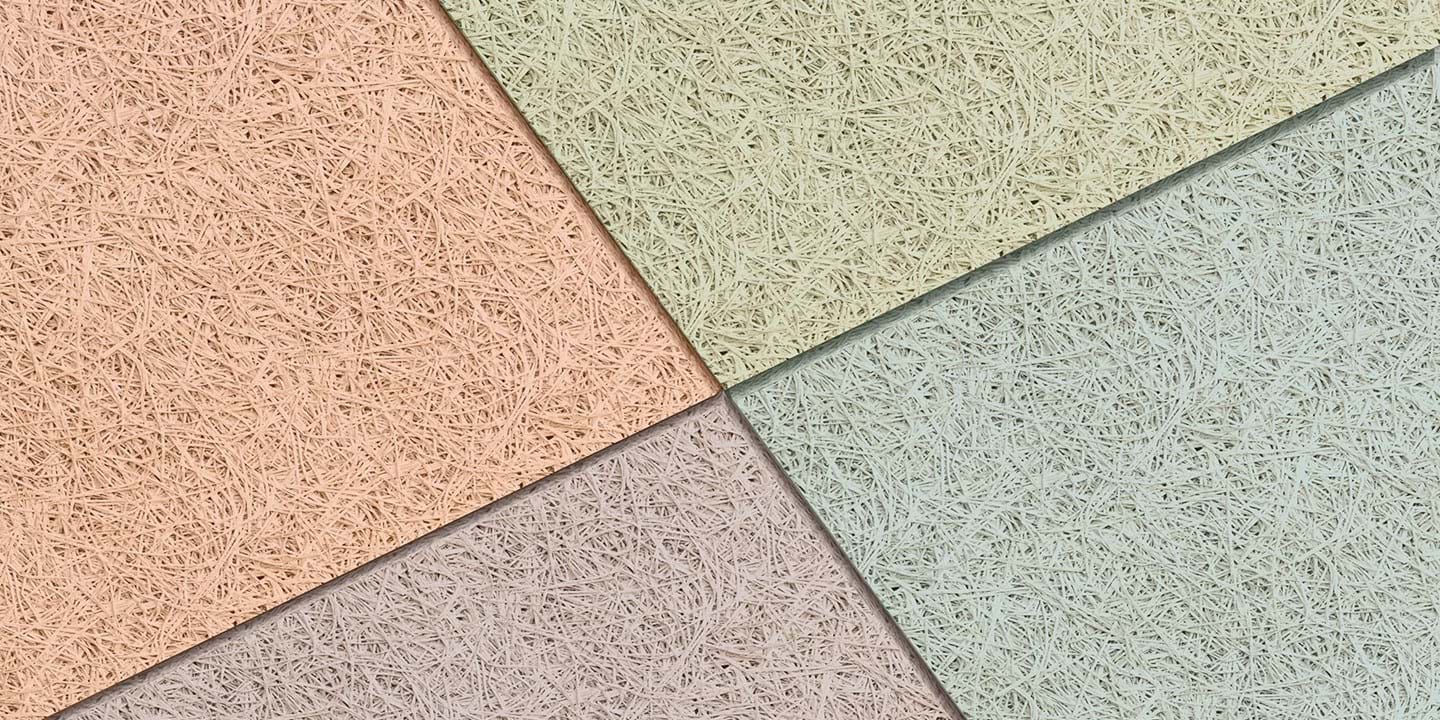 Close-up of acoustic wood wool panels in different pastel colours