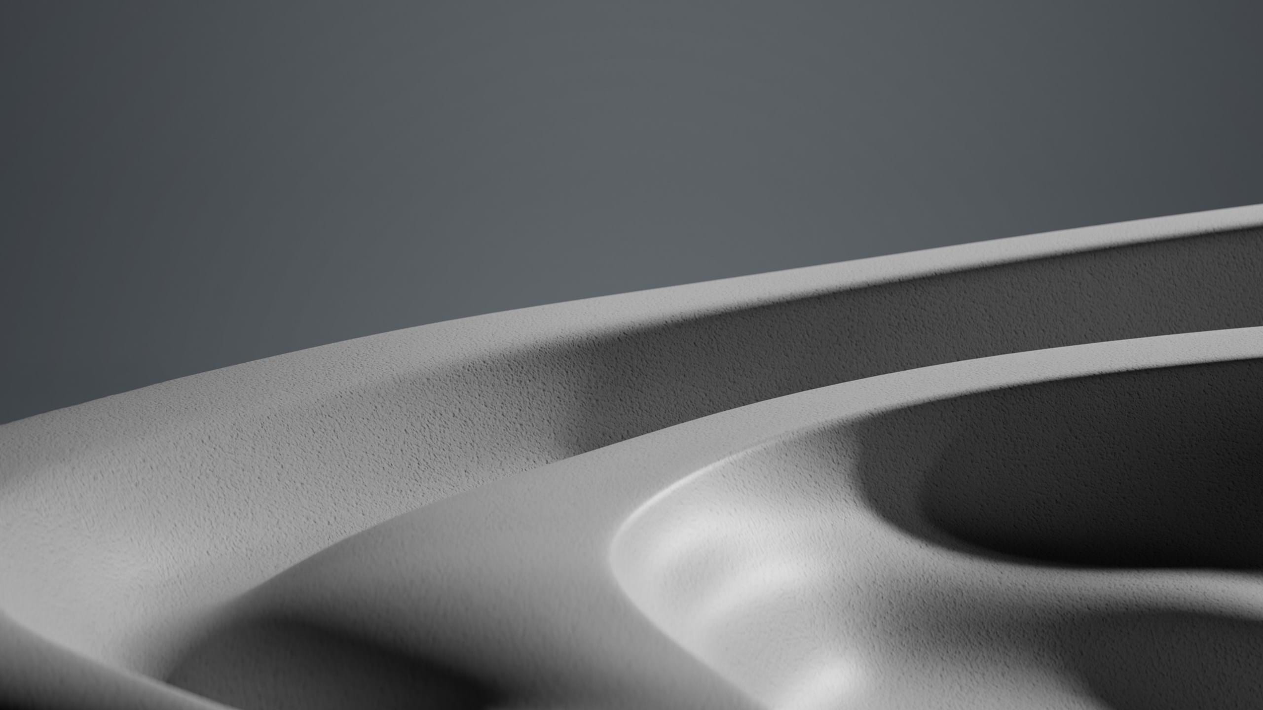 Close-up view of a smooth, curved surface with subtle gradients of light and shadow, creating an abstract monochromatic landscape.