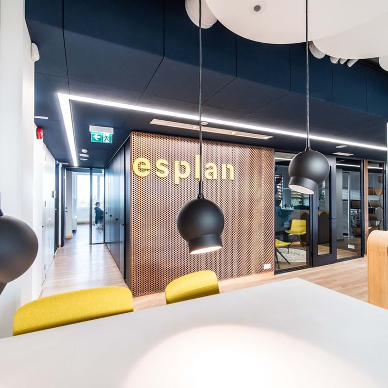 Dark blue, foldable acoustic ceiling in open-plan office